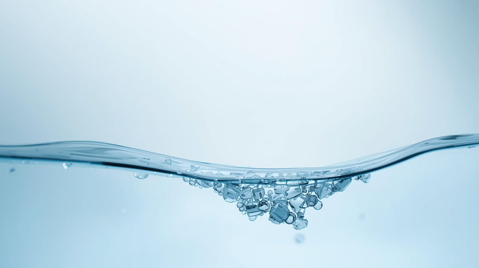 i need a background image for a web page that is , minimalistic, clean, and cool. i need it to represent microplastics being filtered out of bottled water.jpg__PID:3bc192ef-c75d-4fd9-bef1-93759c1ba893